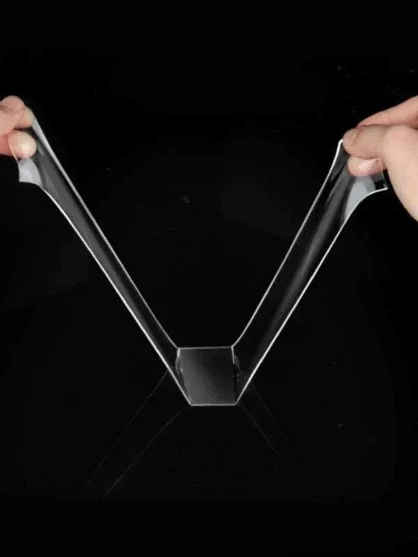 Close-up of double sided reusable tape being applied on various surfaces demonstrating strong, eco-friendly adhesive properties