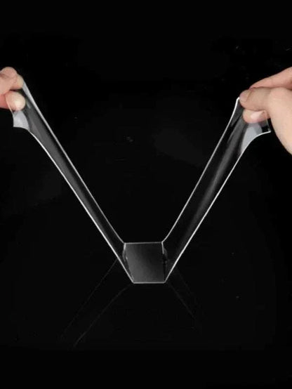 Close-up of double sided reusable tape being applied on various surfaces demonstrating strong, eco-friendly adhesive properties