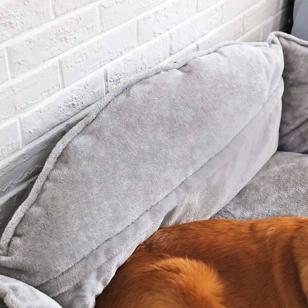 Large dog bed with comfortable, scratch-resistant fabric and optimal support for dogs.