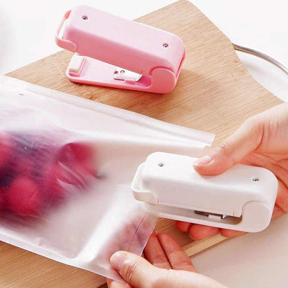 Mini Heat Sealer sealing a plastic bag to keep food fresh and dry
