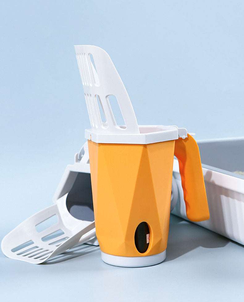 Cat using cat litter box scoop for clean and hygienic litter box maintenance