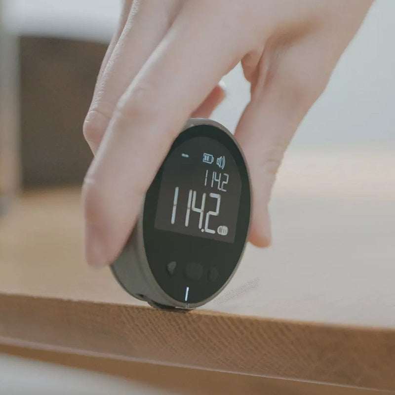 Digital measurement tape displaying measurements with LED screen and versatile settings for accurate measuring