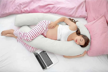U-shaped Sleep Therapy Pillow in beige cradling body for optimal joint positioning and better sleep