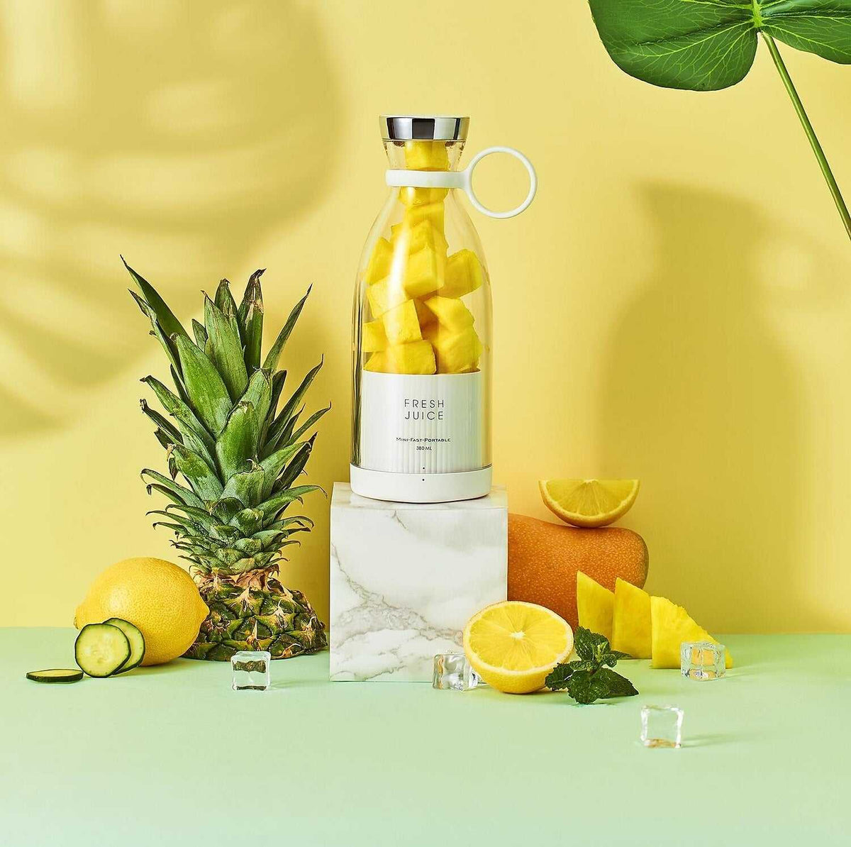 Portable blender bottle blending fresh fruit smoothie on the go, sleek and quiet design