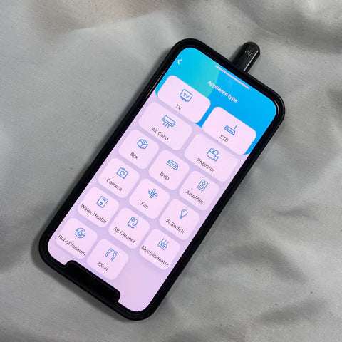 Compact infrared phone adapter device for remote control of multiple electronics