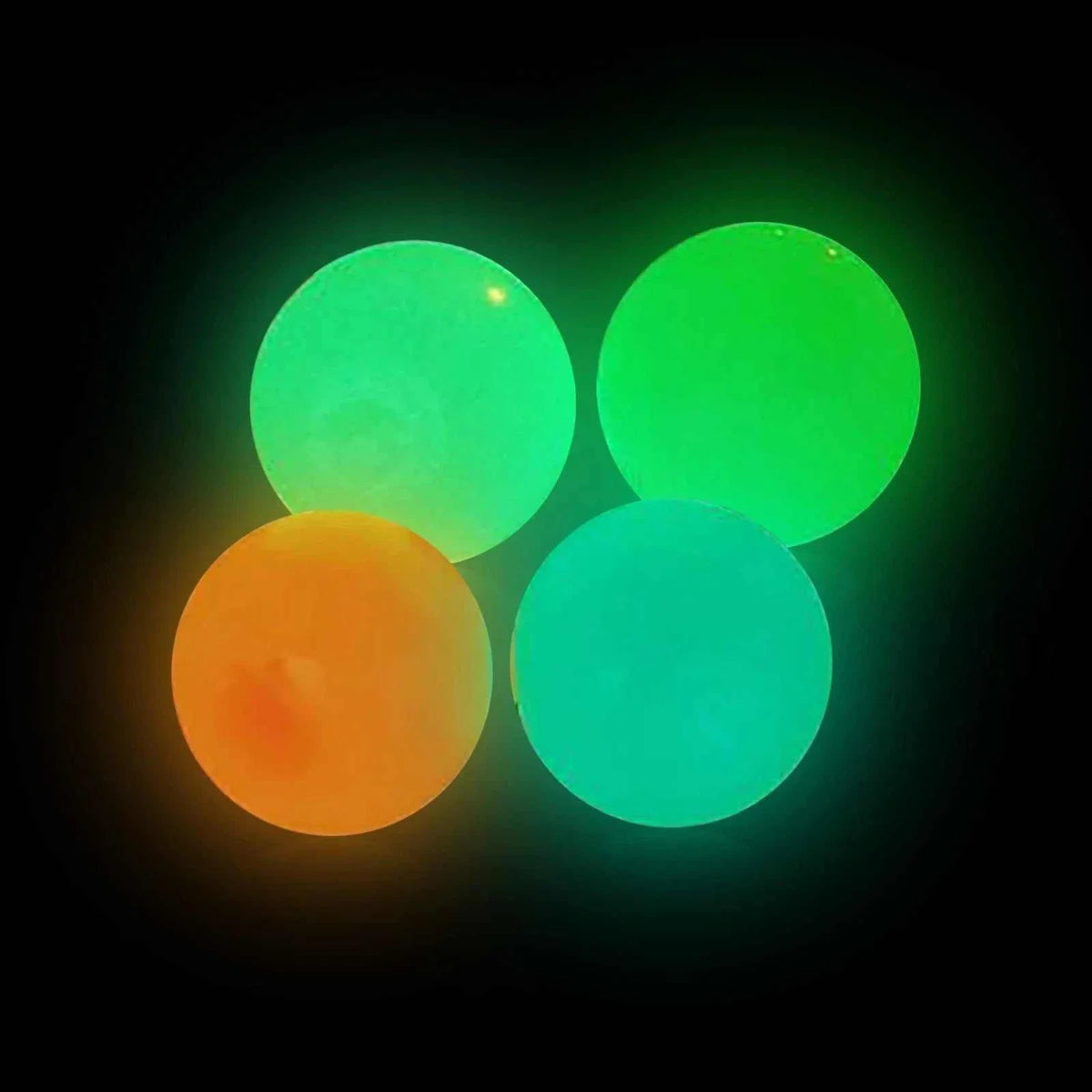 Sticky glow balls glowing in the dark, perfect for late night fun and easy to wash