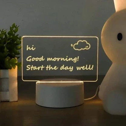 Black LED note board with colorful handwritten notes and drawings illuminated on its surface