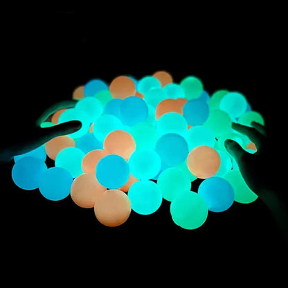 Sticky glow balls glowing in the dark, perfect for late night fun and easy to wash