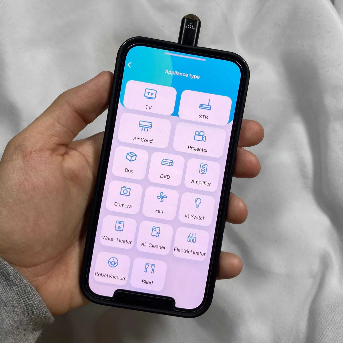 Infrared phone adapter device controlling multiple home electronics with smartphone app