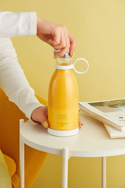 Portable sleek Blender Bottle blending fresh smoothie on the go