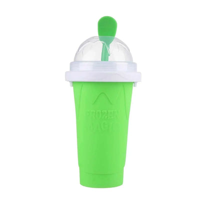 Hand squeezing blue Slush Cup creating fresh homemade slushie drink