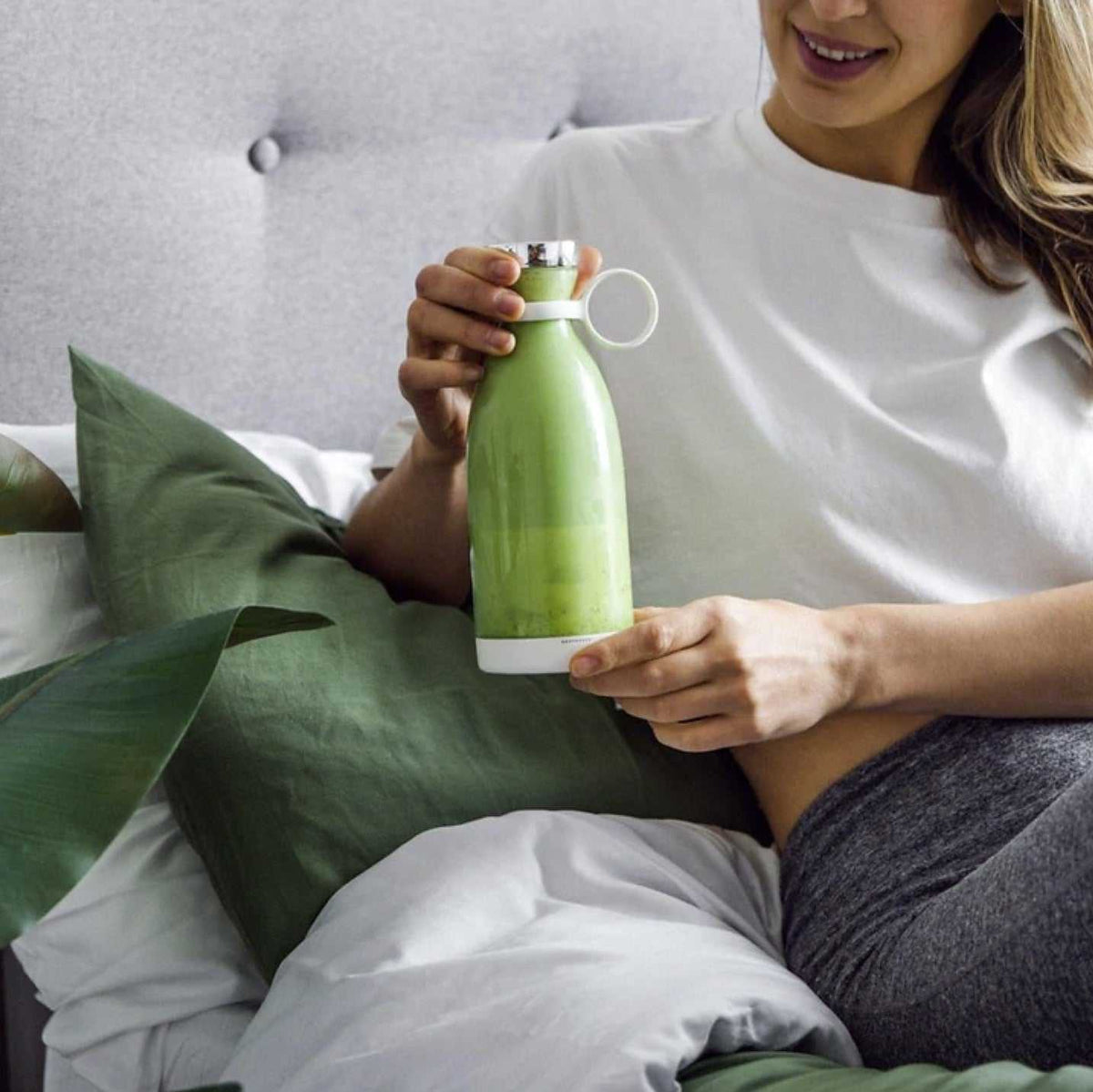 Blender Bottle portable smoothie blender in use with fresh fruit